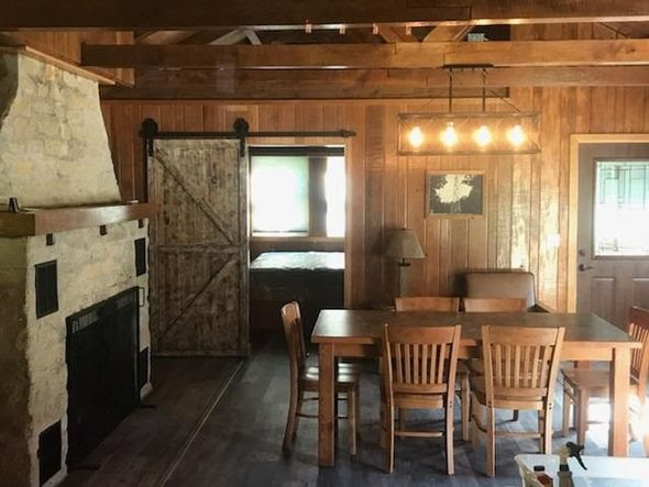 Check out the gorgeous camping cabin (barn door! stone fireplace!) at the stunning Yellow River State Forest |  Iowa DNR